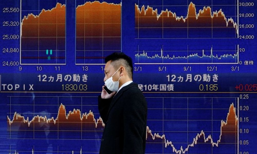 Asian shares slip on hawkish Fed, dollar stands tall